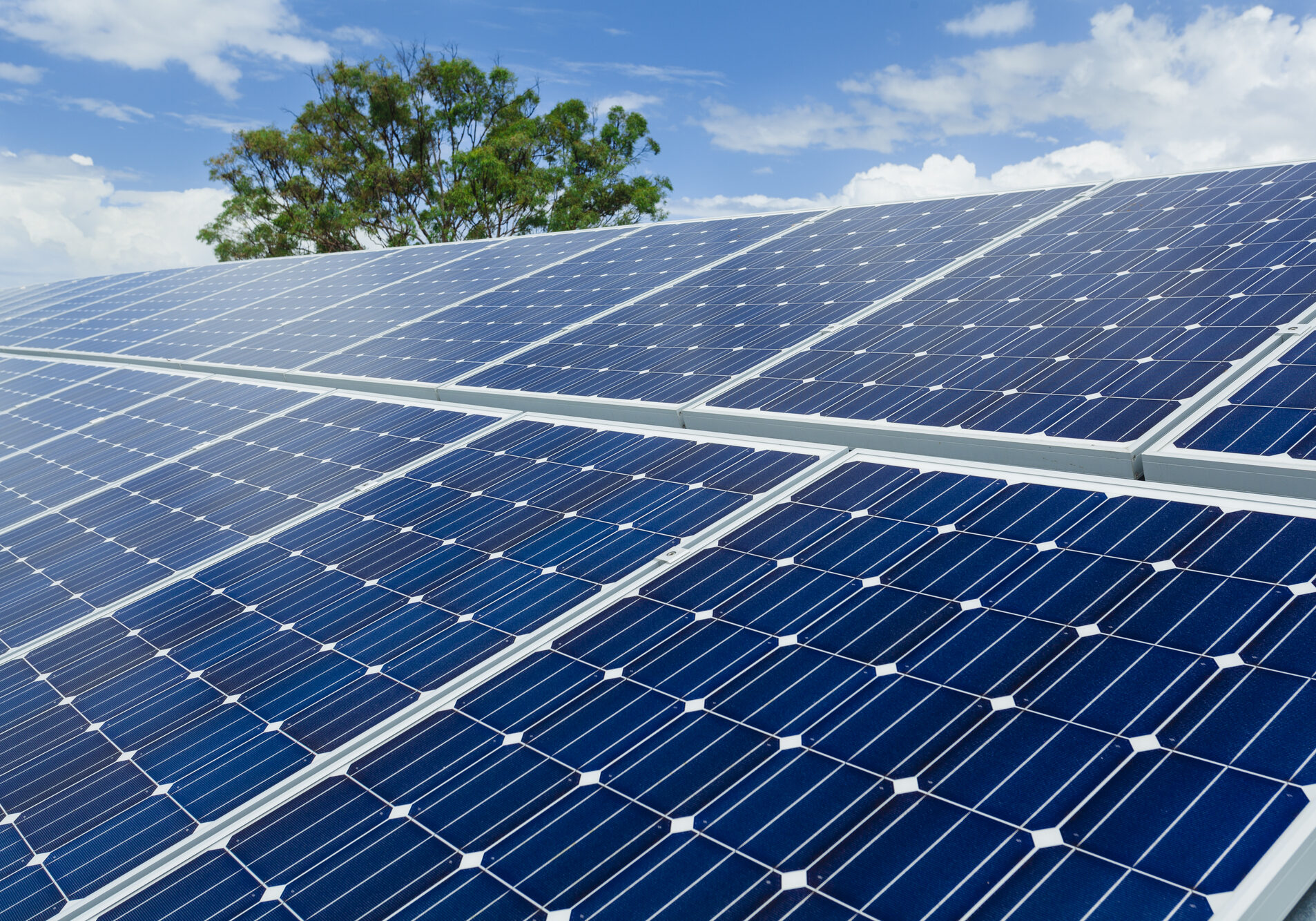 Solar panels on factory roof.